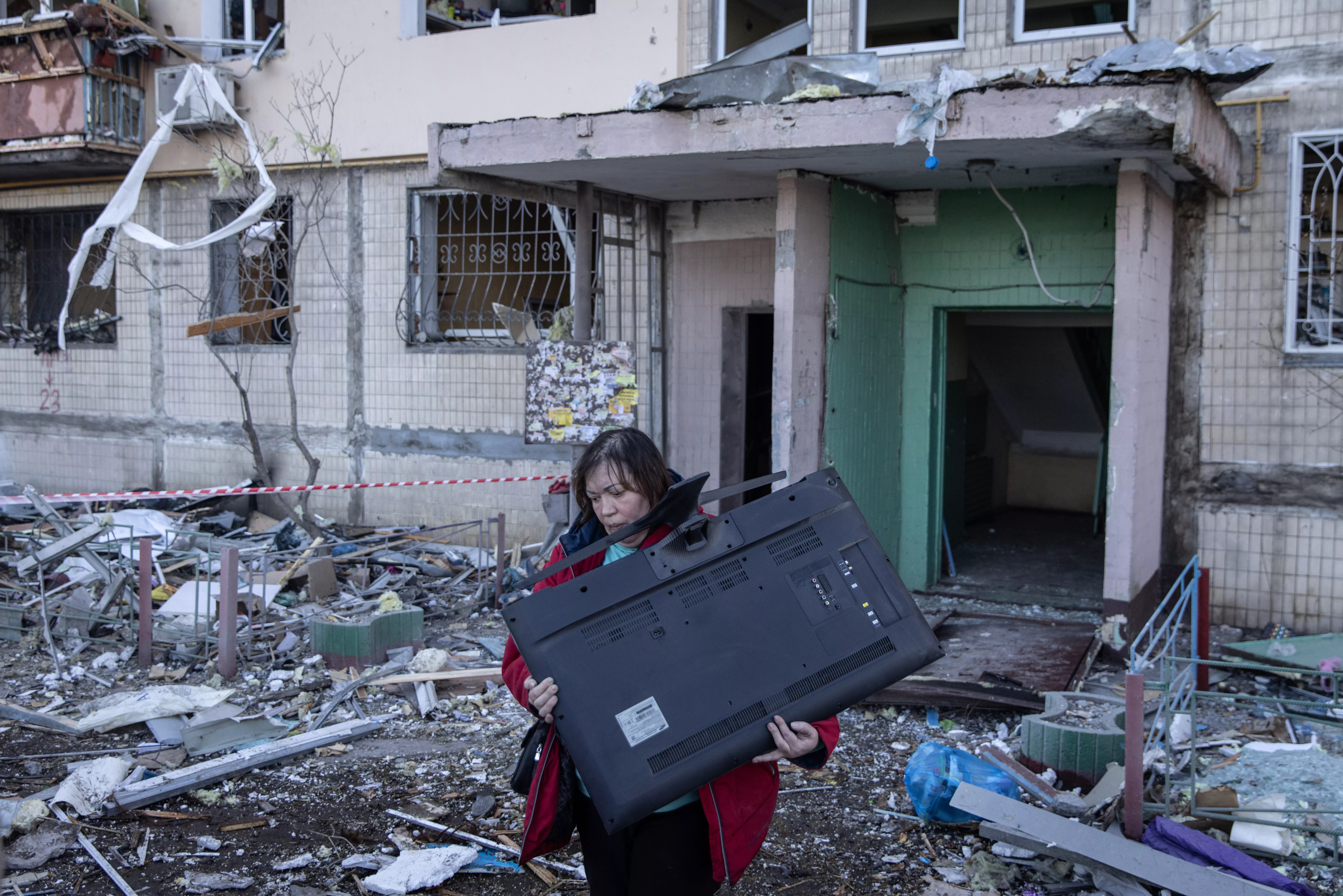 Woman leaving apartment in Kyiv
