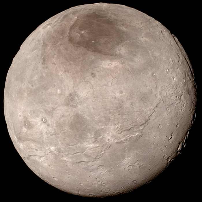 Cientistas determinaram a possível fonte da calota vermelha da lua de Plutão, Caronte