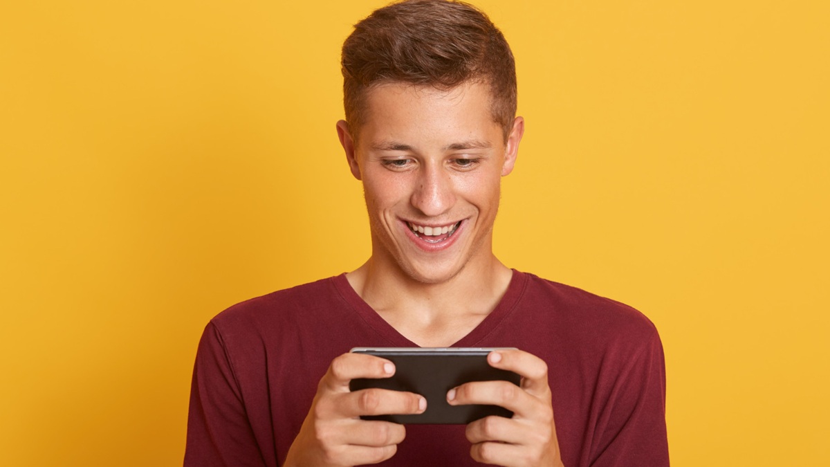 Man playing on phone