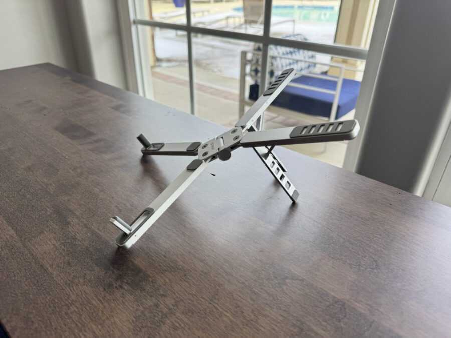 Angled view of ORICO PN-1 stand showing adjustable arms
