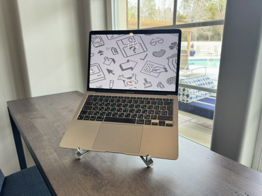 Laptop supported by ORICO PN-1 stand on a desk