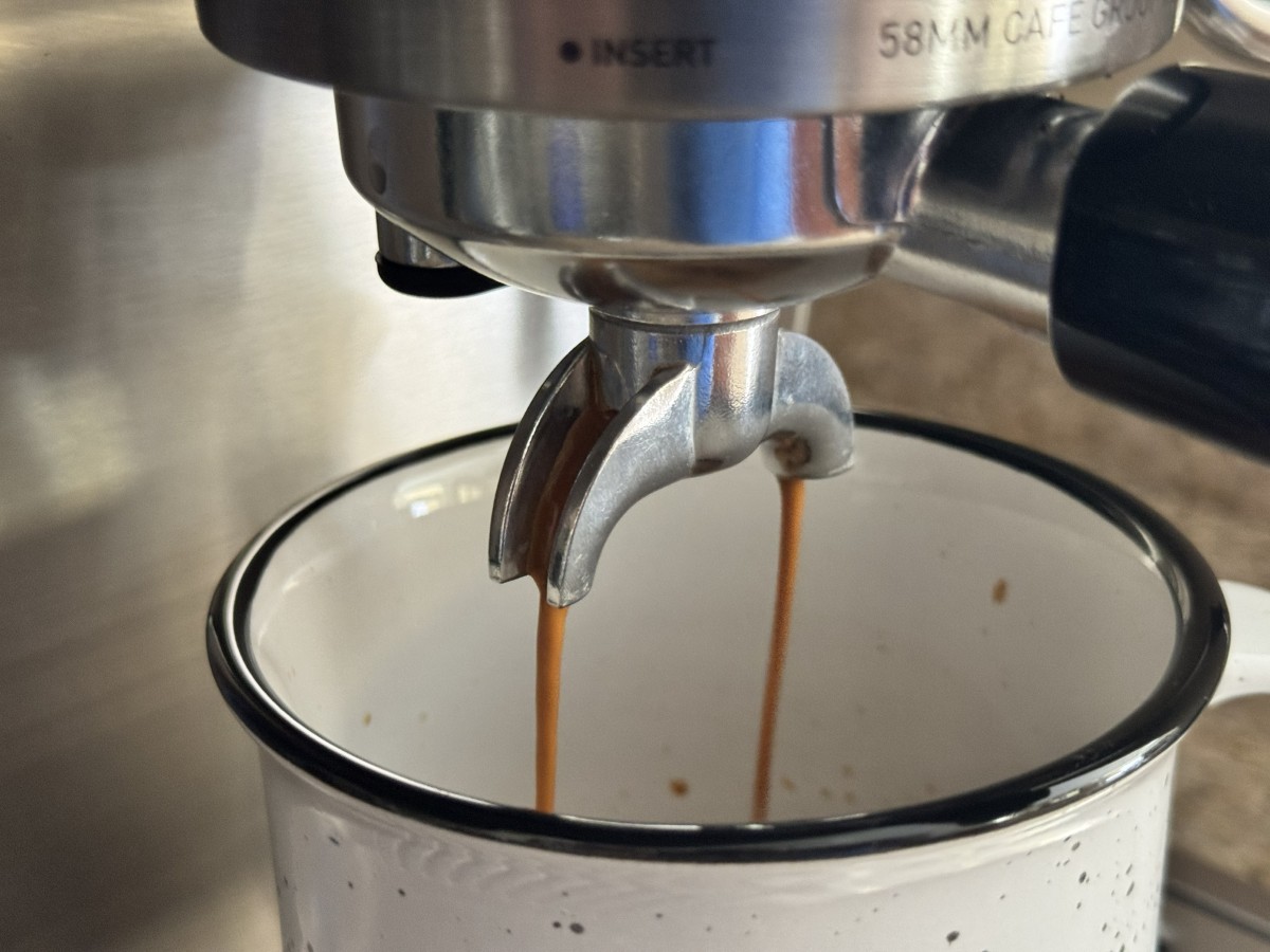 Espresso pouring from the Casabrews Ultra portafilter into a cup Espresso pouring from the Casabrews Ultra portafilter into a cup