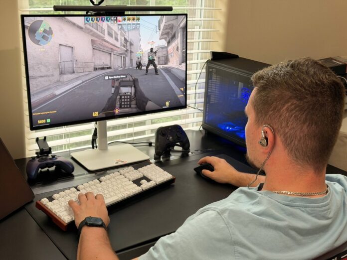 User wearing ATK Horizon earphones while playing Counter-Strike 2 on a desktop gaming setup. User wearing ATK Horizon earphones while playing Counter-Strike 2 on a desktop gaming setup.