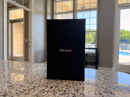 Minimalist ATK Horizon presentation box standing upright on a countertop.