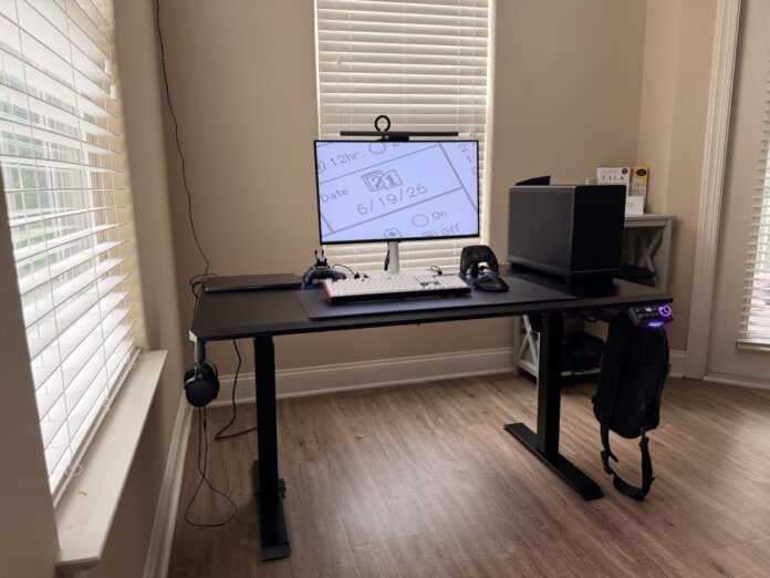 DXRacer Tidal XL standing desk with gaming PC, monitor, and productivity setup. DXRacer Tidal XL standing desk with gaming PC, monitor, and productivity setup.