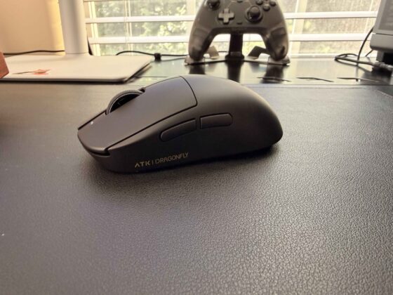Left-side profile of the ATK Dragonfly A9 Mini+ showing its two thumb buttons and scroll wheel.