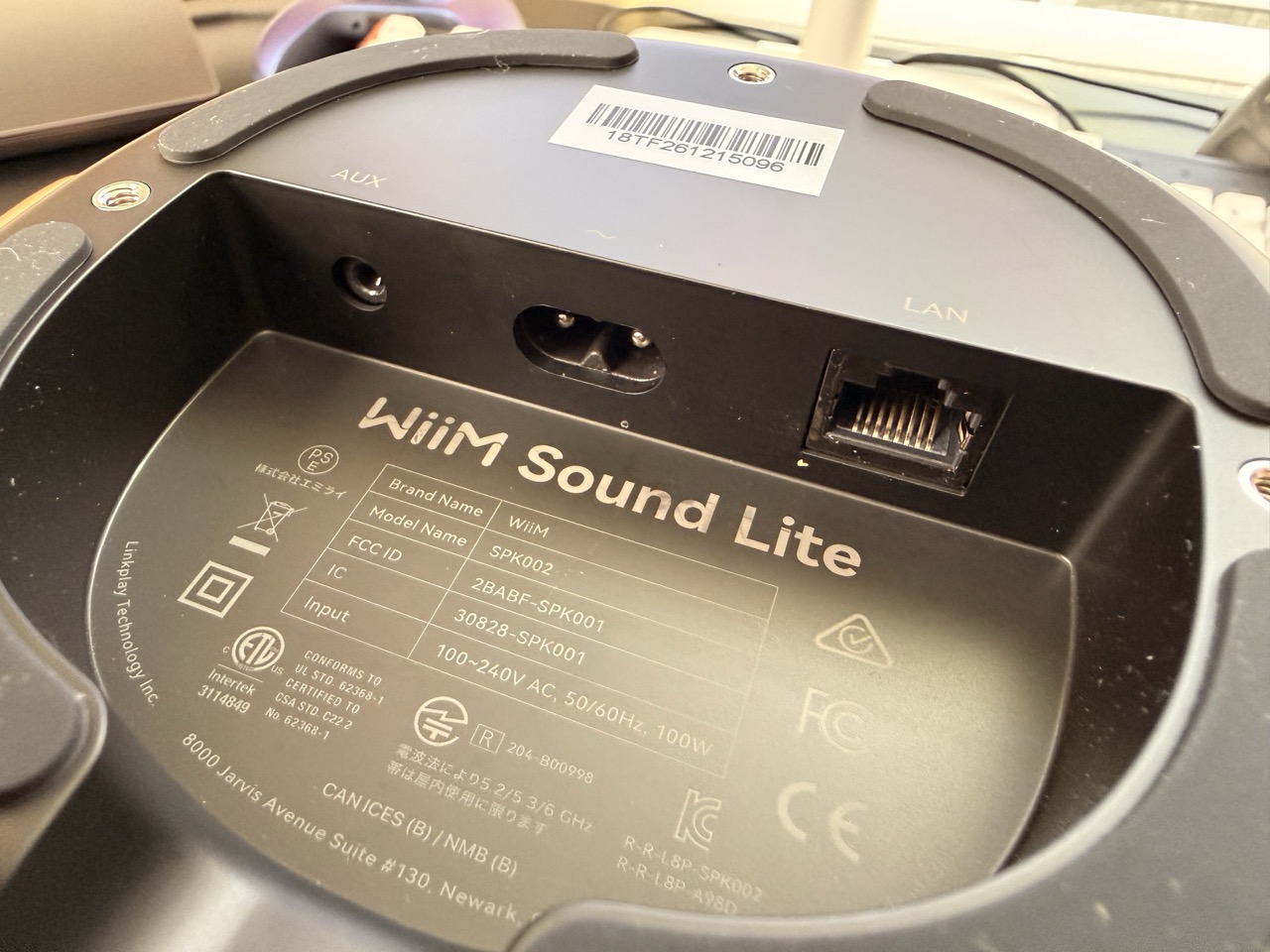 Bottom view of the WiiM Sound Lite showing the power input, LAN port, and rubber feet Bottom view of the WiiM Sound Lite showing the power input, LAN port, and rubber feet.