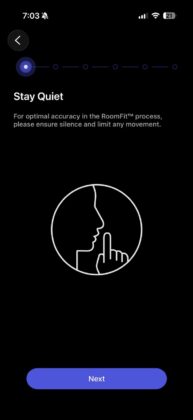 WiiM Home app RoomFit setup reminding the user to remain quiet during the room calibration process.